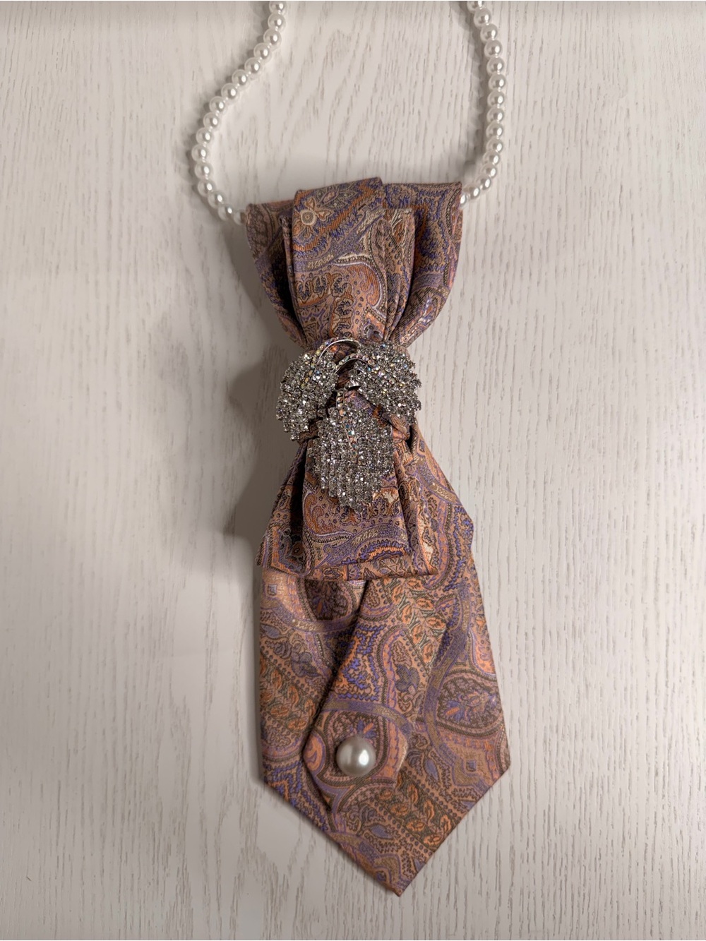 Necklace with Peach & Purple Paisley Pendant and Rhinestone Brooch
Handmade